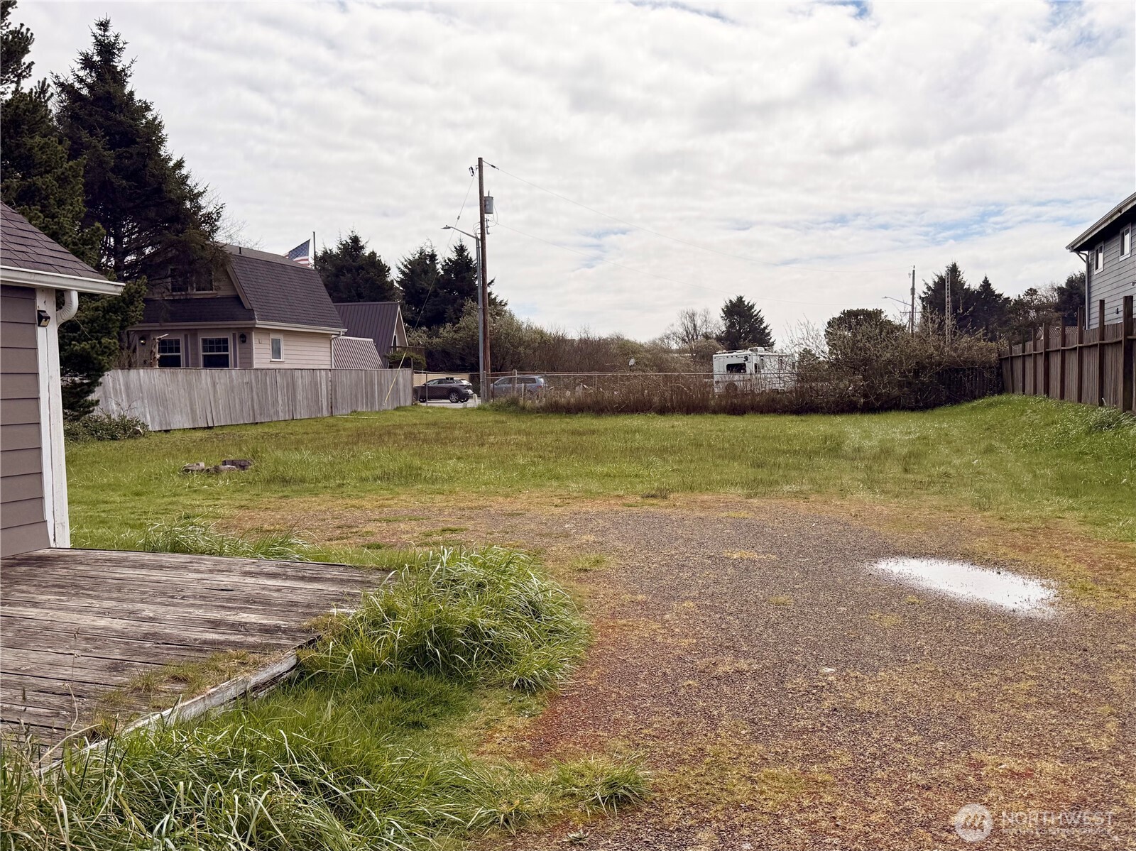 141 Barnacle Street Ocean Shores, WA 98569 - Photo 27 of 27 a view of a lake with a big yard