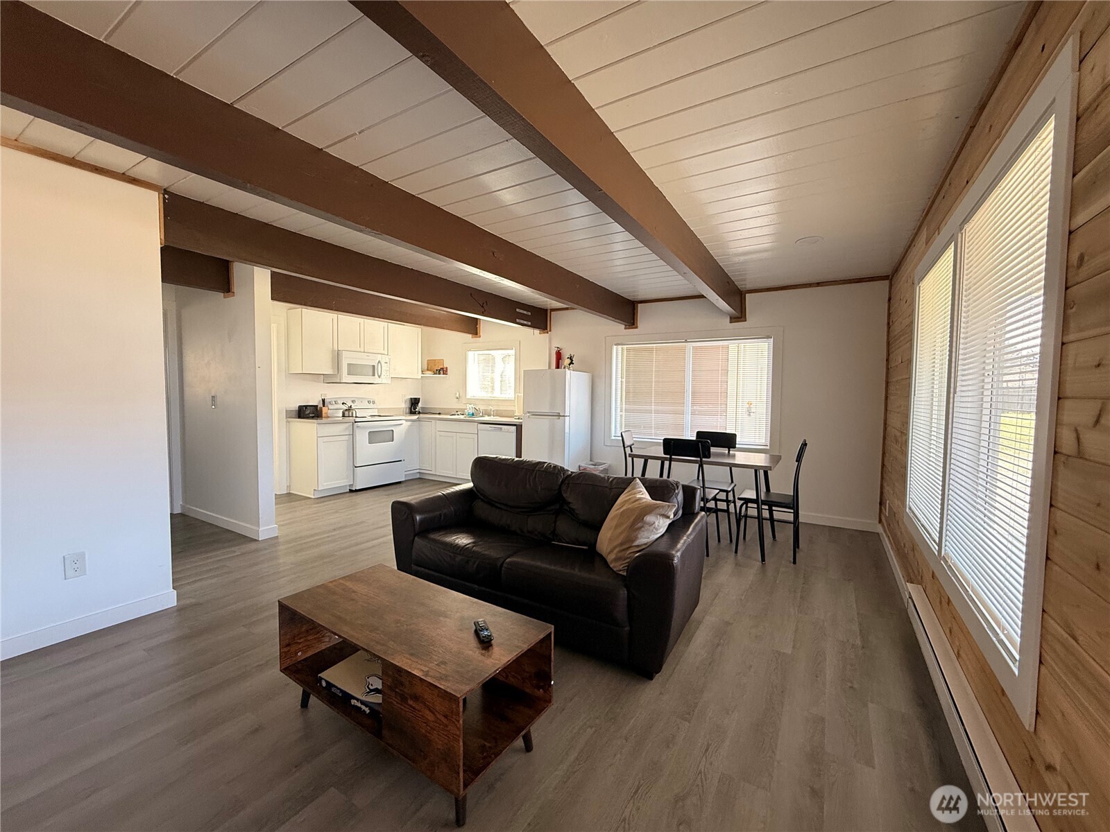 141 Barnacle Street Ocean Shores, WA 98569 - Photo 4 of 27 a living room with furniture and a large window