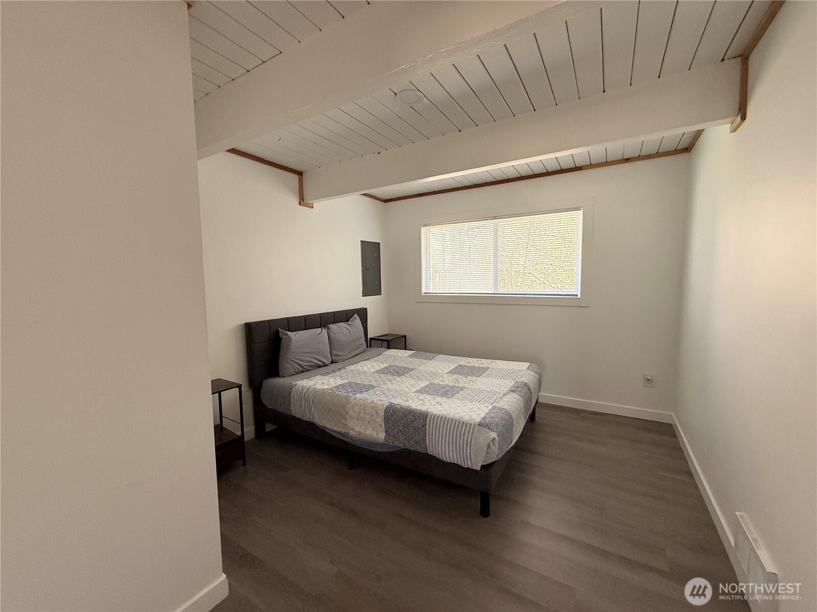 141 Barnacle Street Ocean Shores, WA 98569 - Photo 8 of 27 a bedroom with a bed and window