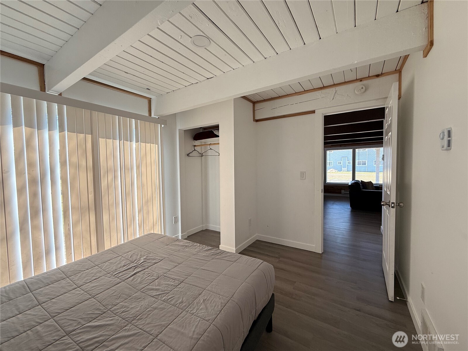 141 Barnacle Street Ocean Shores, WA 98569 - Photo 10 of 27 a bedroom with a bed and a window