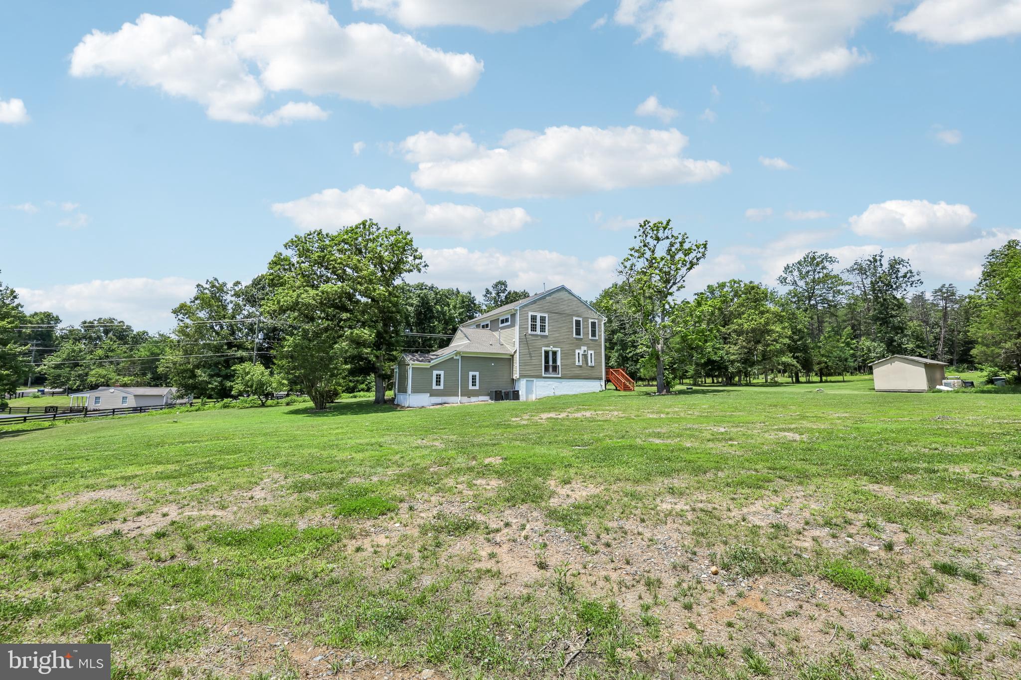 12304 Popes Head Road Fairfax, VA 22030 - Photo 73 of 78 a view of a big yard with a house in the background