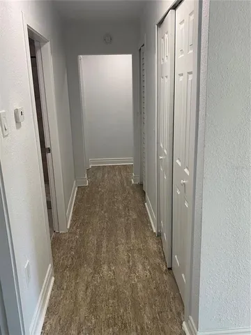 a kitchen with stainless steel appliances granite countertop a refrigerator a stove and a sink