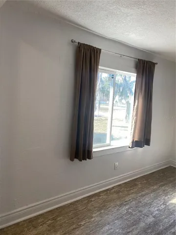 a view of a refrigerator in kitchen and livingroom