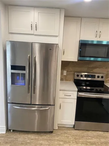 a view of yard with wooden fence