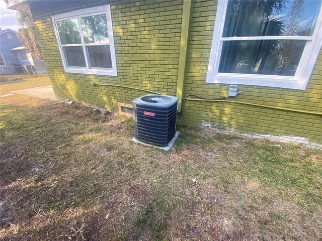 a view of an empty room with a floor to ceiling window