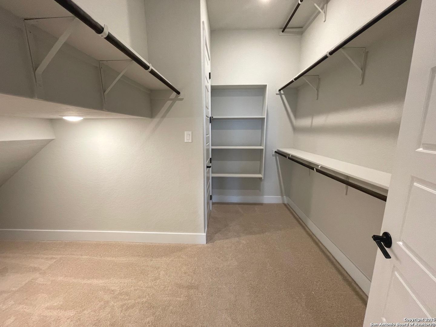 20675 Huebner Road, Unit 525 San Antonio, TX 78258 - Photo 15 of 19 a view of an empty walk in closet
