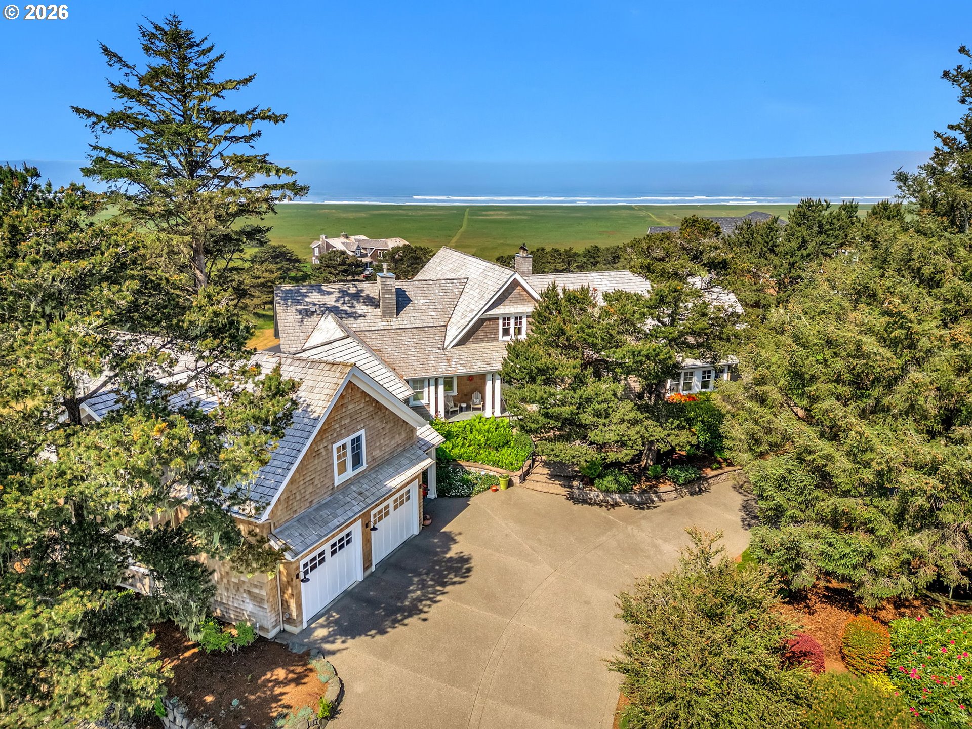 89079 Pinehurst Road Warrenton, OR 97146 - Photo 1 of 46 an aerial view of a house with a yard and lake view