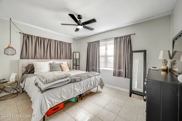 a living room with a bed furniture and a window
