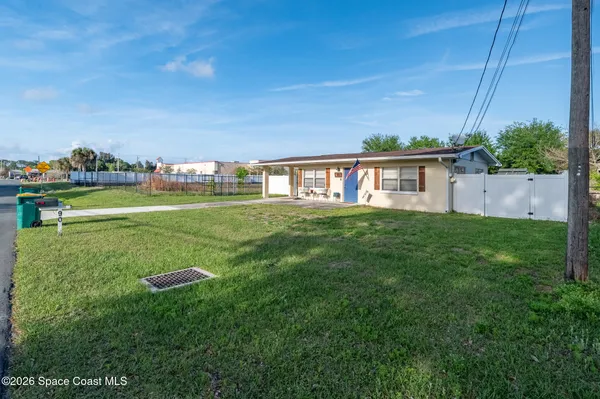 a view of a house with a big yard