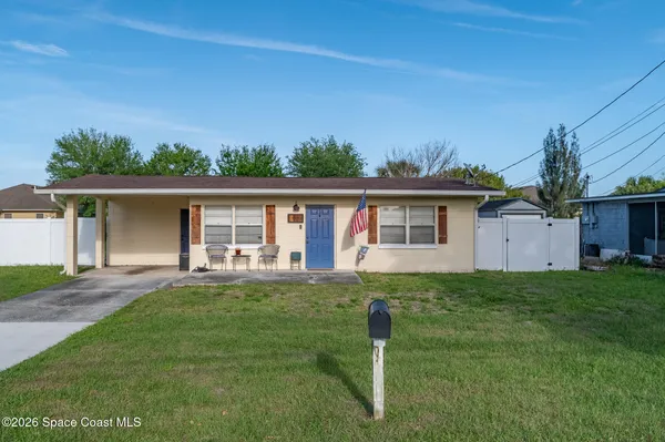 front view of a house with a yard
