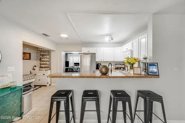 a kitchen with stainless steel appliances granite countertop a sink and cabinets