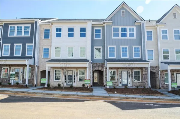 a view of a brick building with a door and a window