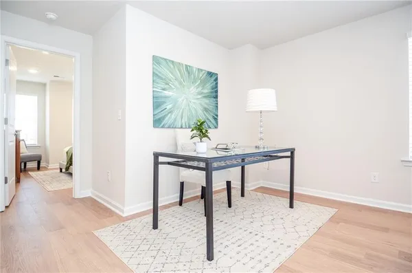 a bathroom with a granite countertop sink a toilet and shower