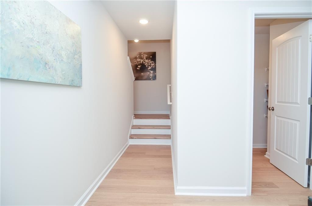 4551 High Rdg Court Sugar Hill, GA 30518 - Photo 27 of 40 a view of a hallway with wooden floor and entryway