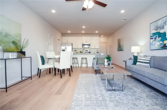 a living room with furniture and a rug