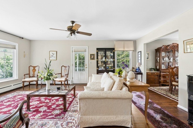 33 Carol Road Westfield, NJ 07090 - Photo 5 of 23 a living room with furniture a chandelier and a large window