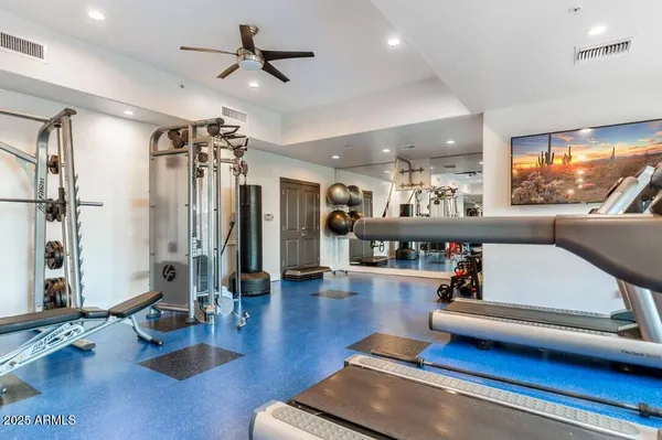 a room with gym equipment and a large window