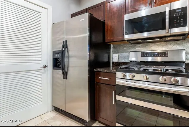 a kitchen with appliances and cabinets