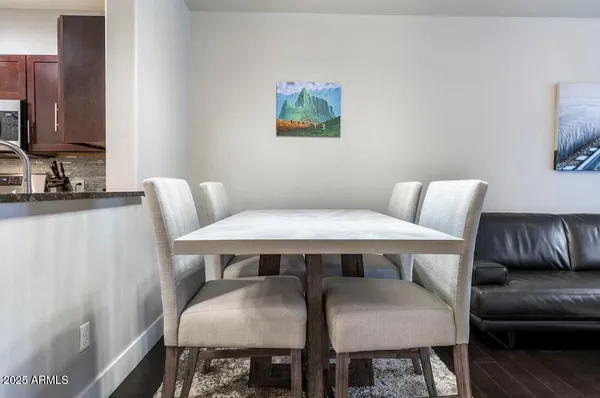 a view of a dining room with furniture and wooden floor