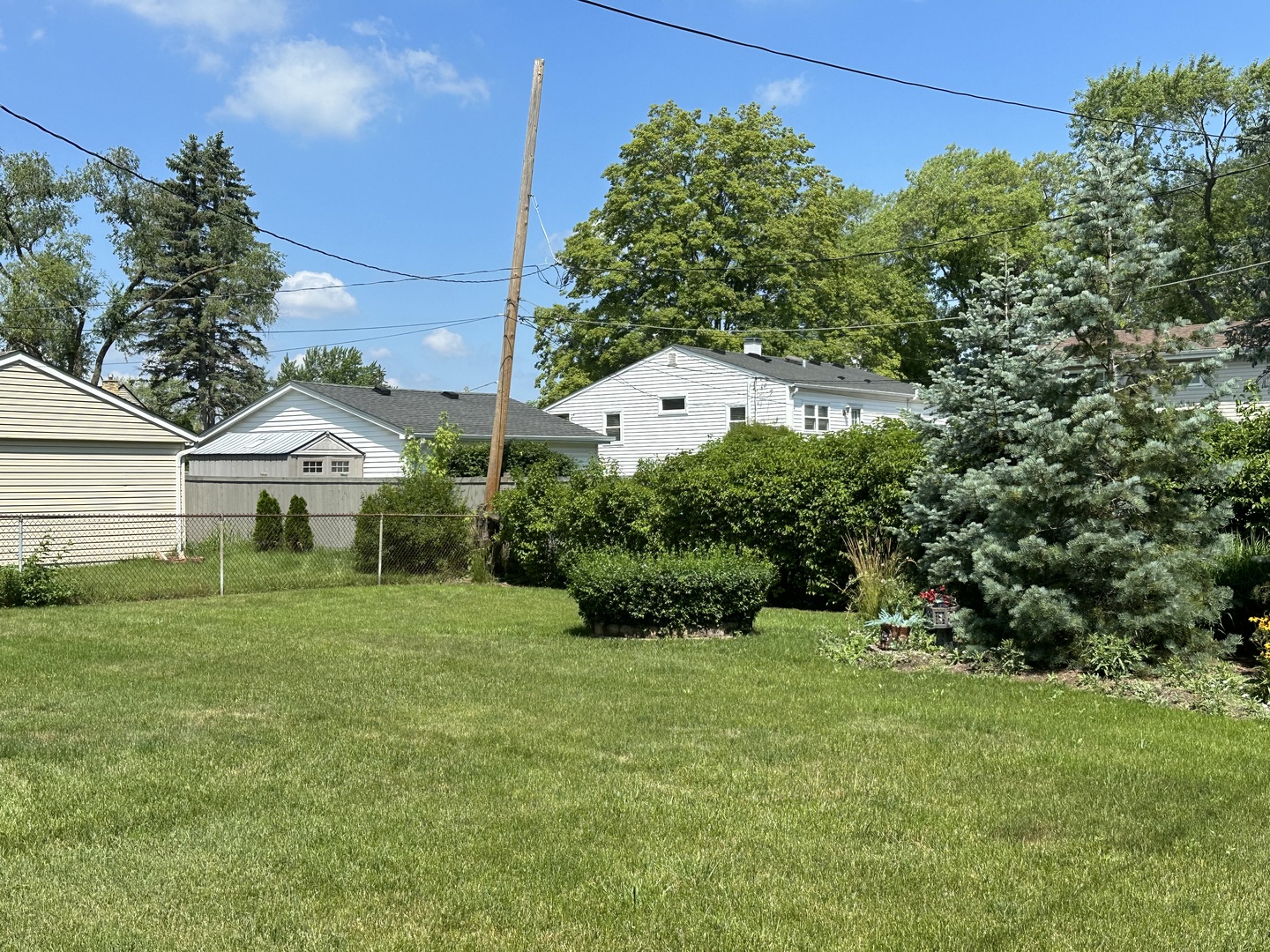 692 Maple Drive Buffalo Grove, IL 60089 - Photo 16 of 18 a view of a house with a yard