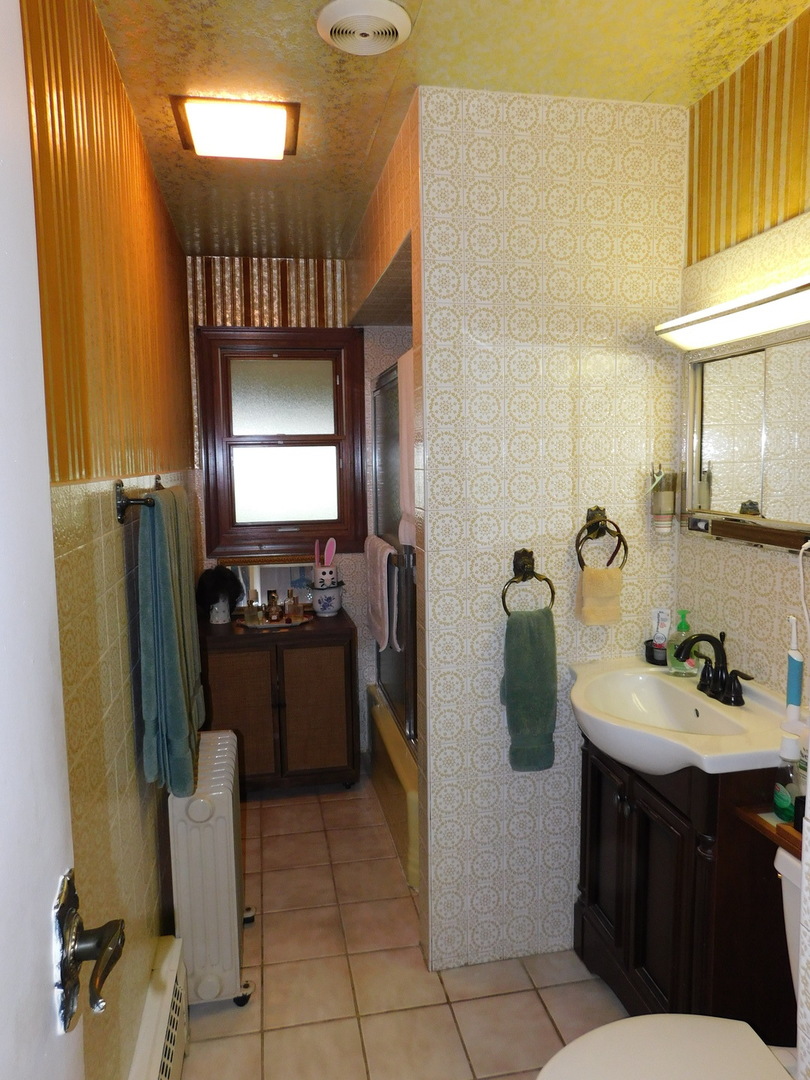 692 Maple Drive Buffalo Grove, IL 60089 - Photo 9 of 18 a kitchen with stainless steel appliances granite countertop a refrigerator and a sink
