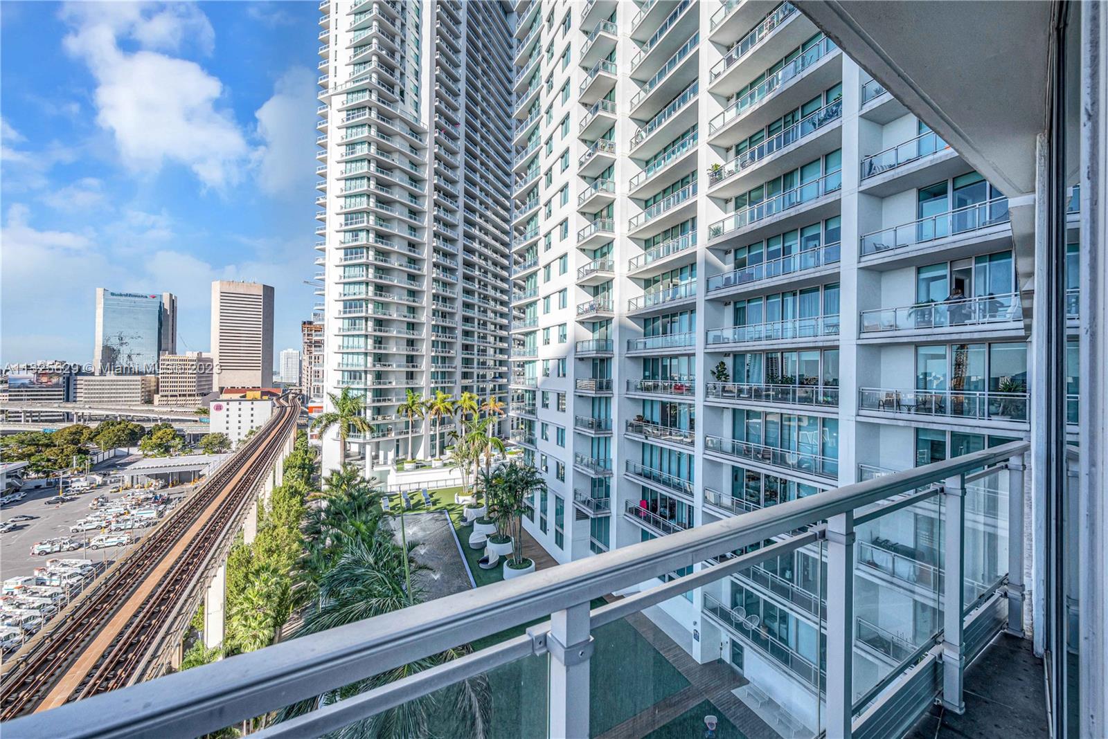 92 Southwest 3rd Street, Unit 1605 Miami, FL 33130 - Photo 28 of 37 a view of balcony with wooden floor and fence
