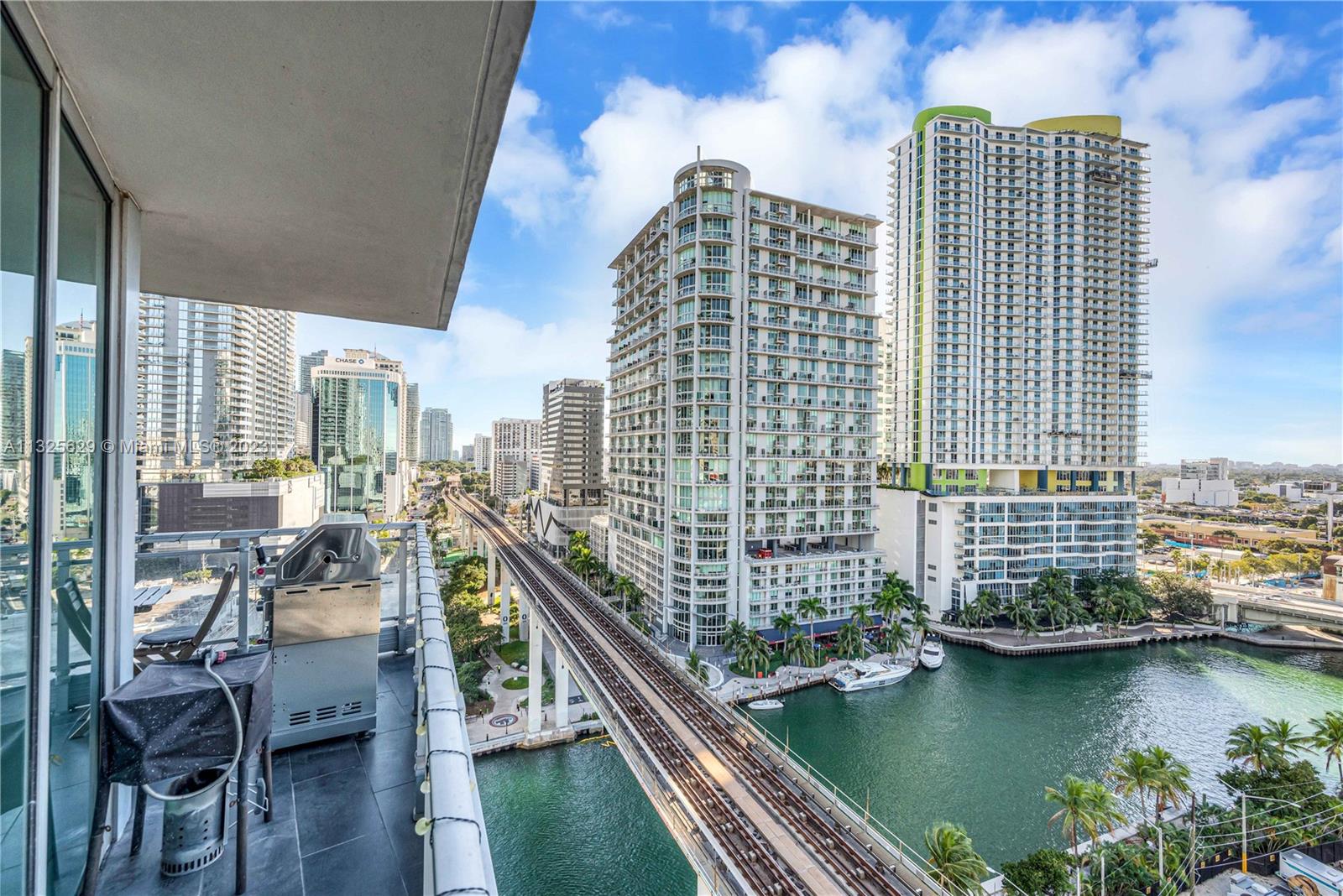 92 Southwest 3rd Street, Unit 1605 Miami, FL 33130 - Photo 6 of 37 a view of a balcony with chairs