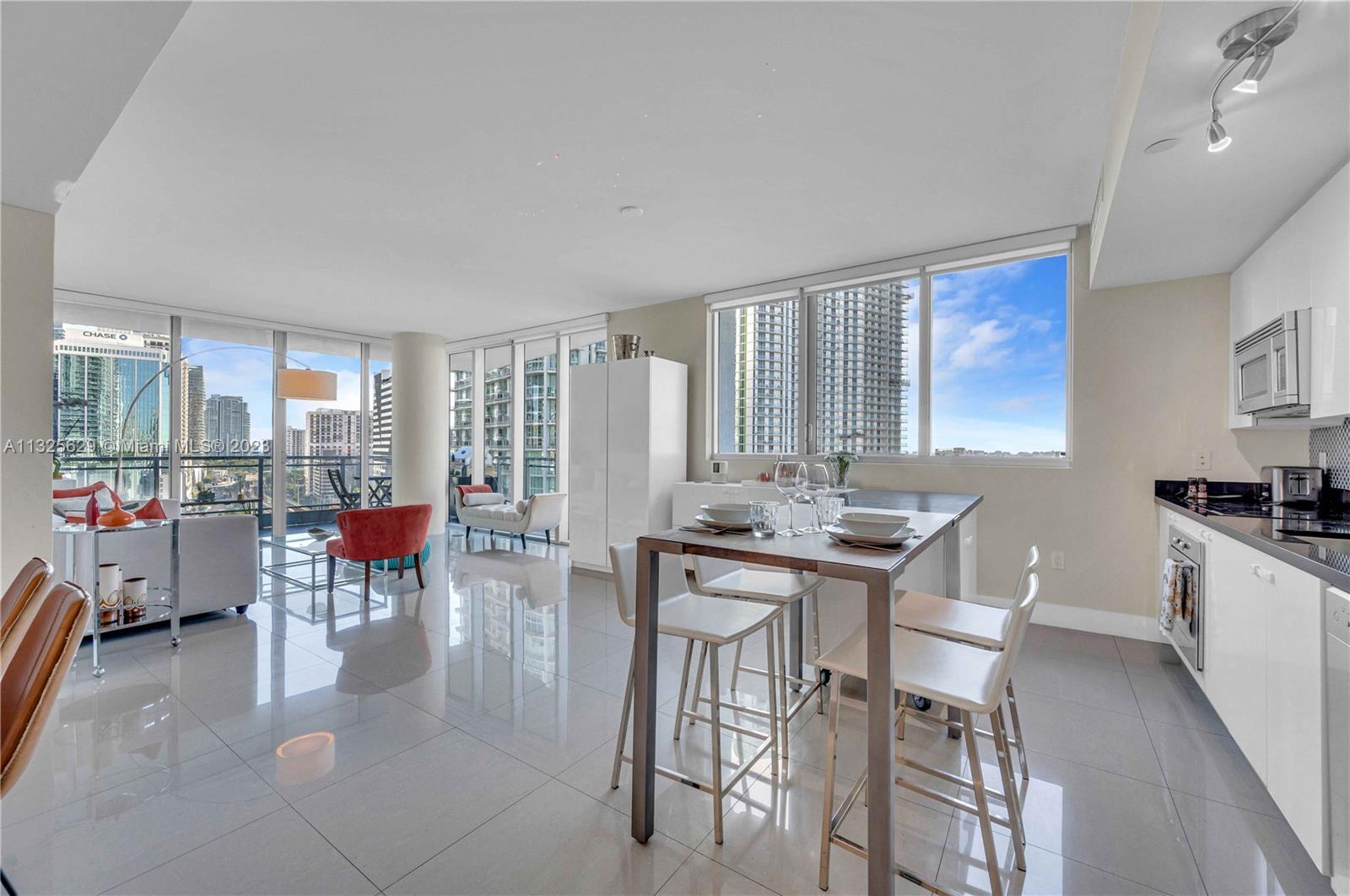 92 Southwest 3rd Street, Unit 1605 Miami, FL 33130 - Photo 8 of 37 a view of a dining room with furniture and a livingroom