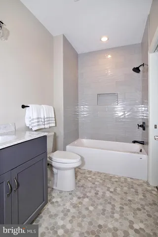 a bathroom with a toilet a sink and a bathtub