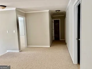 a view of a hallway with closet and a room