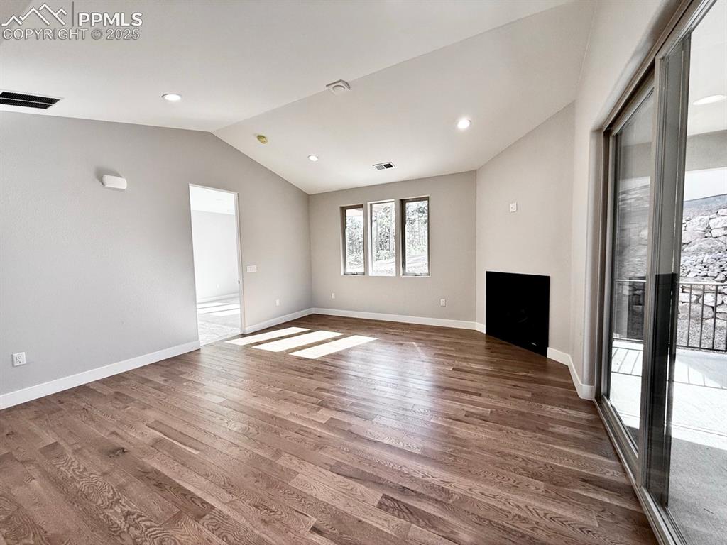 3155 Promise Point Colorado Springs, CO 80921 - Photo 16 of 26 a view of empty room with wooden floor and fan
