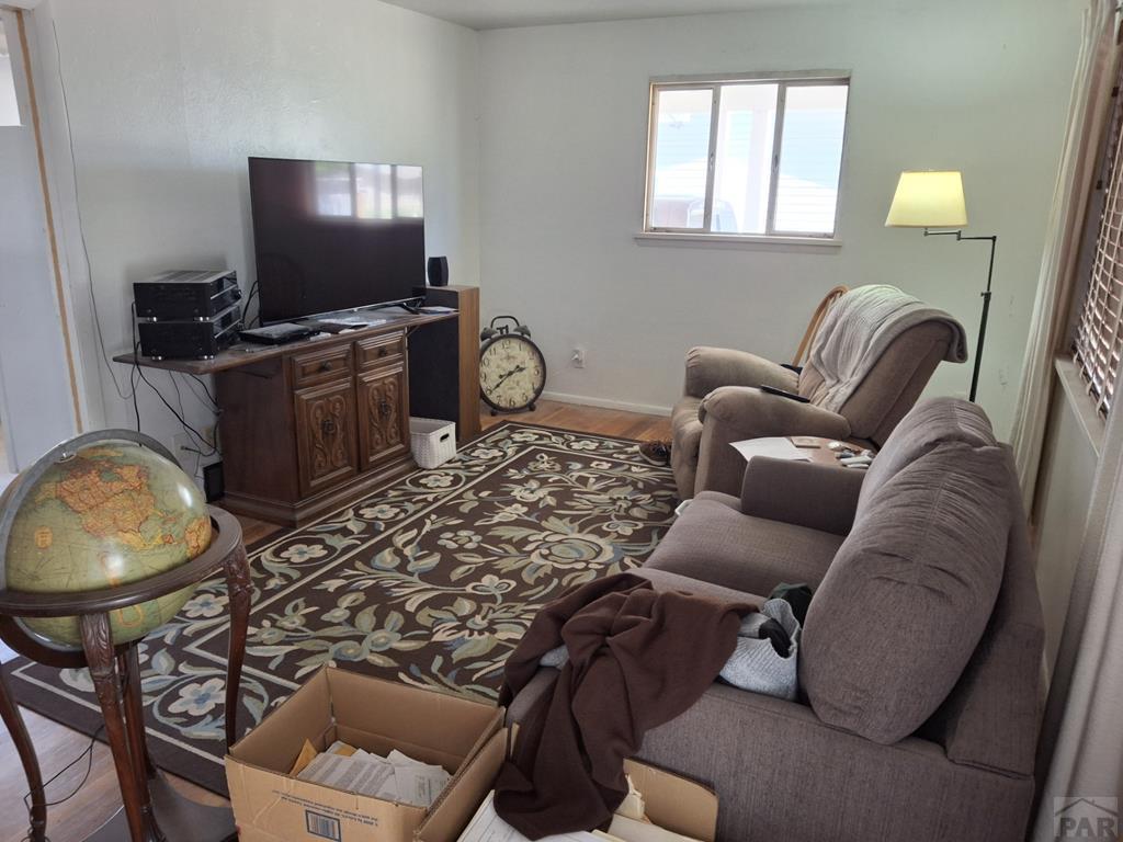 214 3rd Street Fowler, CO 81039 - Photo 2 of 15 a living room with furniture and a flat screen tv
