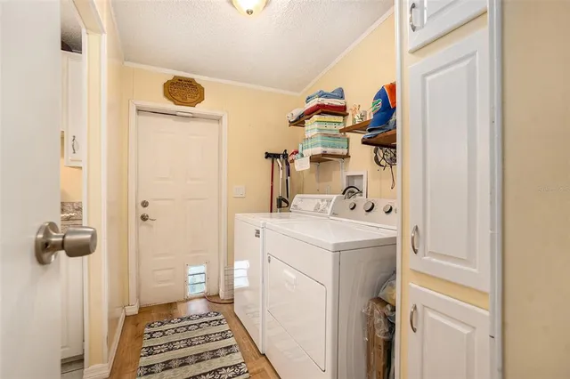 a building outdoor space with patio furniture and potted plants