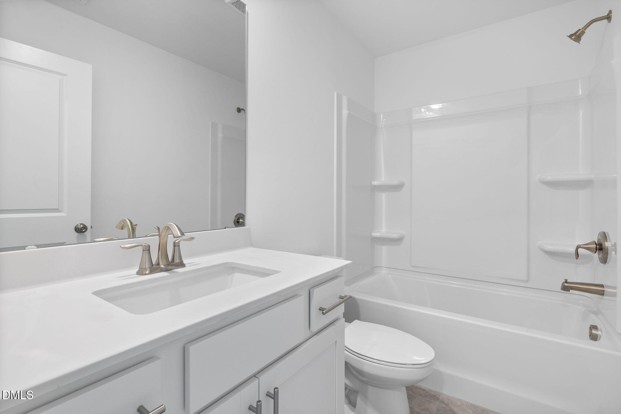 421 Deep Oak Drive, Unit SAWYER Rolesville, NC 27571 - Photo 14 of 16 a bathroom with a sink a toilet and a bathtub