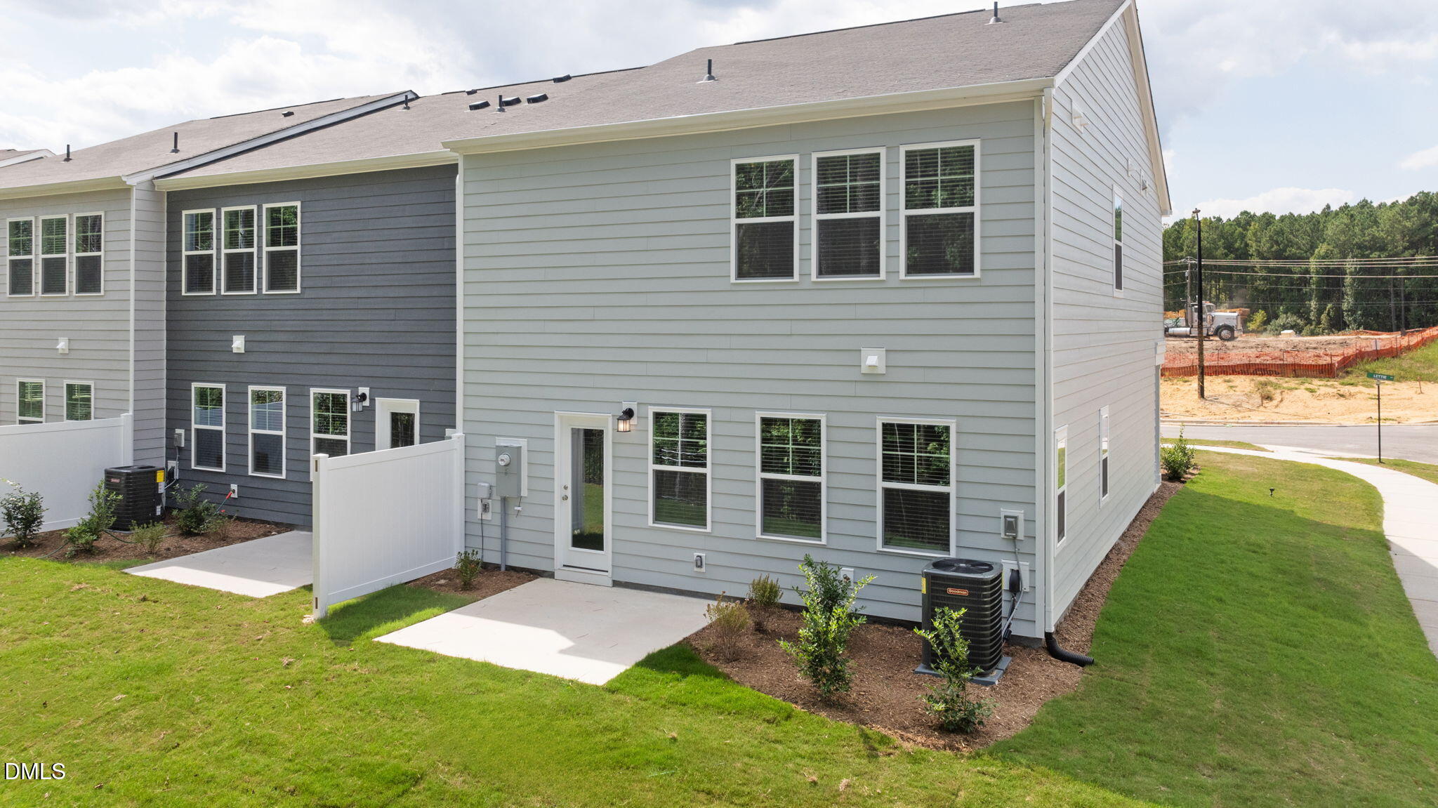 421 Deep Oak Drive, Unit SAWYER Rolesville, NC 27571 - Photo 16 of 16 a view of a house with backyard and sitting area