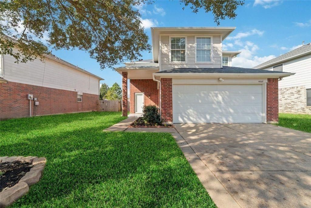 4007 Starbridge Pointe Lane Katy, TX 77449 - Photo 1 of 30 a front view of house with yard