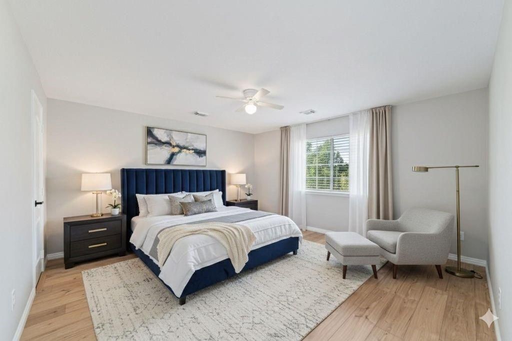 4007 Starbridge Pointe Lane Katy, TX 77449 - Photo 16 of 30 a bedroom with a bed and wooden floor