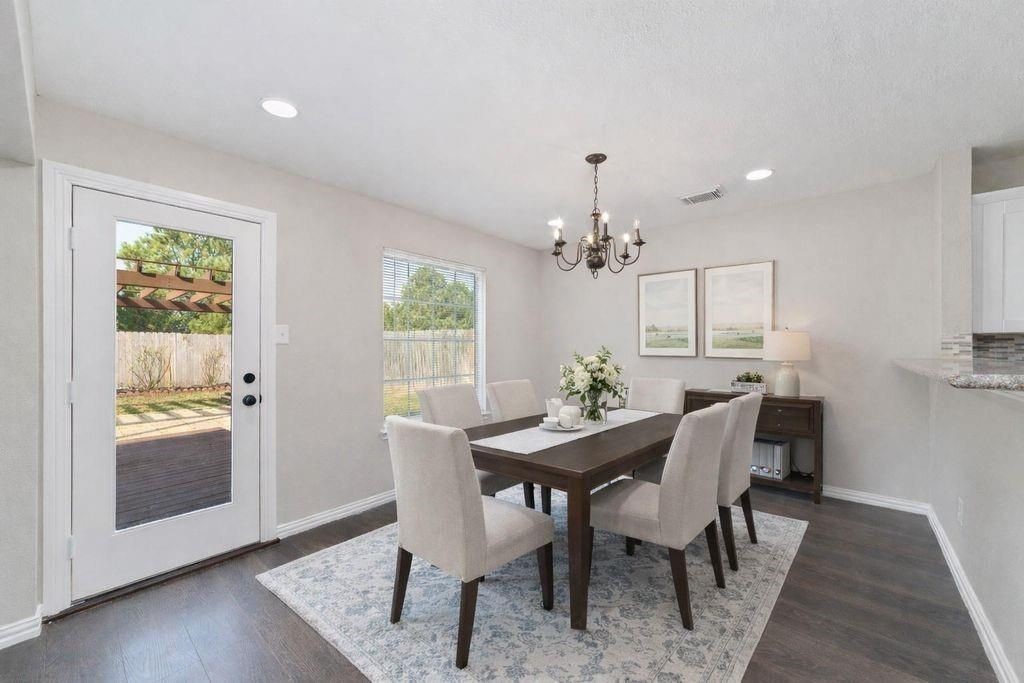 4007 Starbridge Pointe Lane Katy, TX 77449 - Photo 8 of 30 a view of a dining room with furniture window and wooden floor