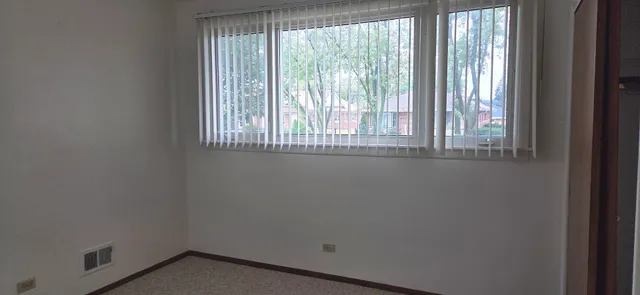 a view of an empty room and window
