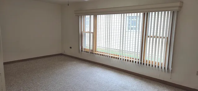 a view of a room that has a large window