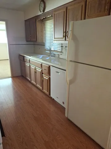 a kitchen with stainless steel appliances a refrigerator and a sink