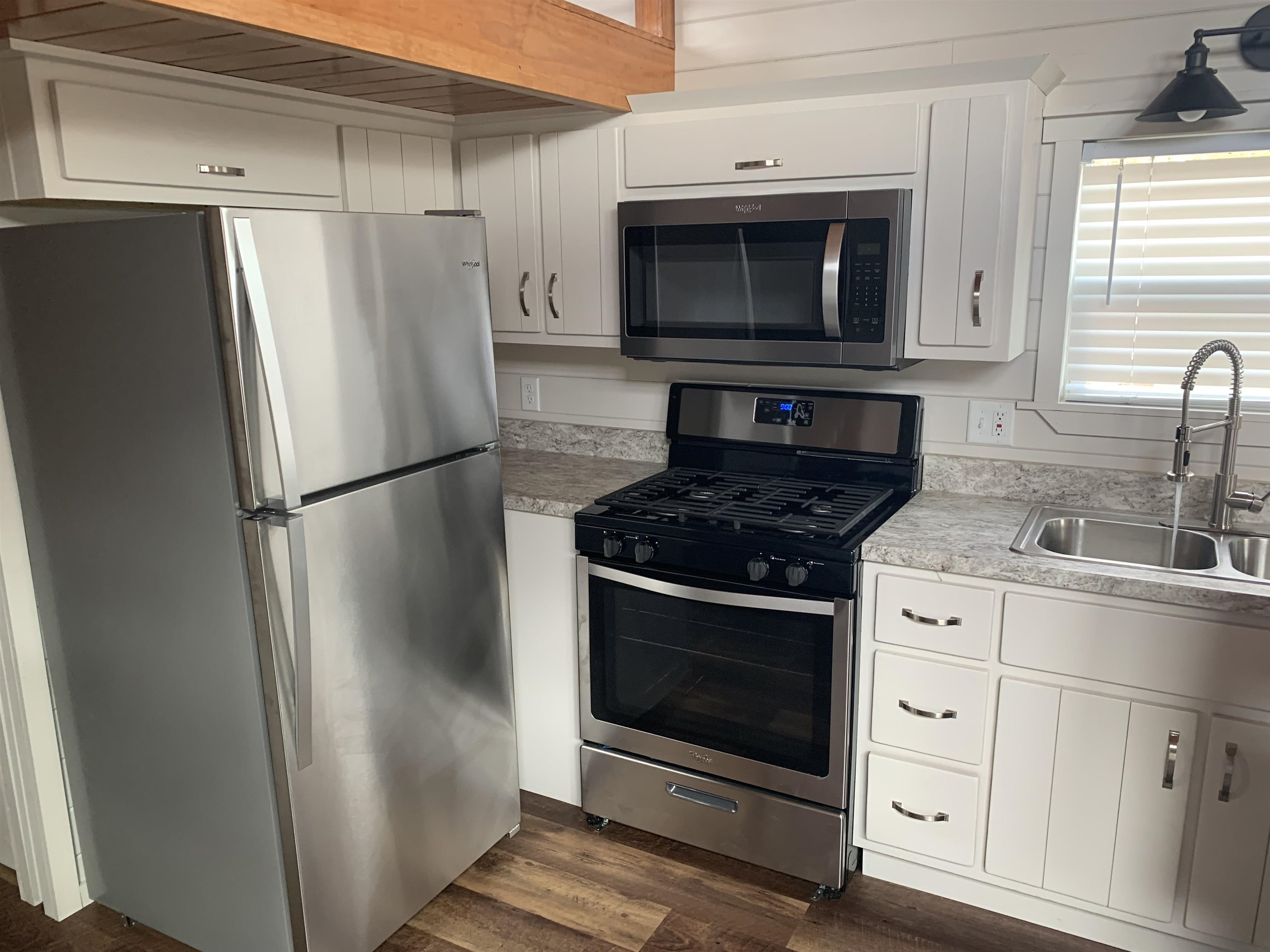 Tbd Dunns Gap Road Hot Springs, VA 24445 - Photo 8 of 13 a kitchen with stainless steel appliances a stove a microwave and a refrigerator