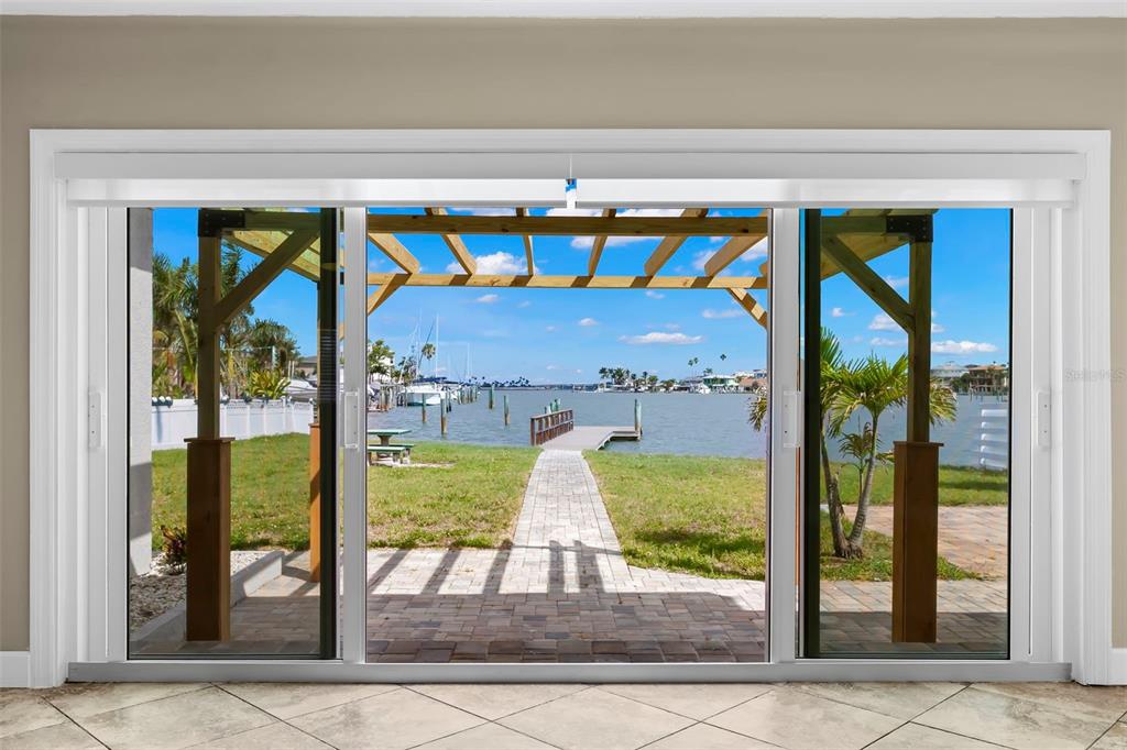 708 Sunset Cove Madeira Beach, FL 33708 - Photo 22 of 61 a view of porch with a potted plant