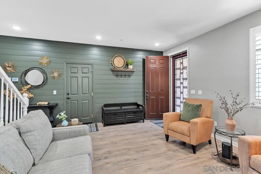 10700 Spring Creek Drive Santee, CA 92071 - Photo 12 of 74 a living room with furniture and a fireplace