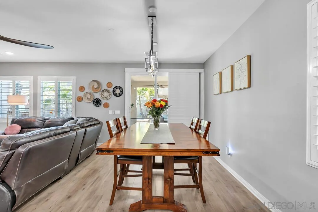 10700 Spring Creek Drive Santee, CA 92071 - Photo 19 of 74 a view of a dining room with furniture window and wooden floor