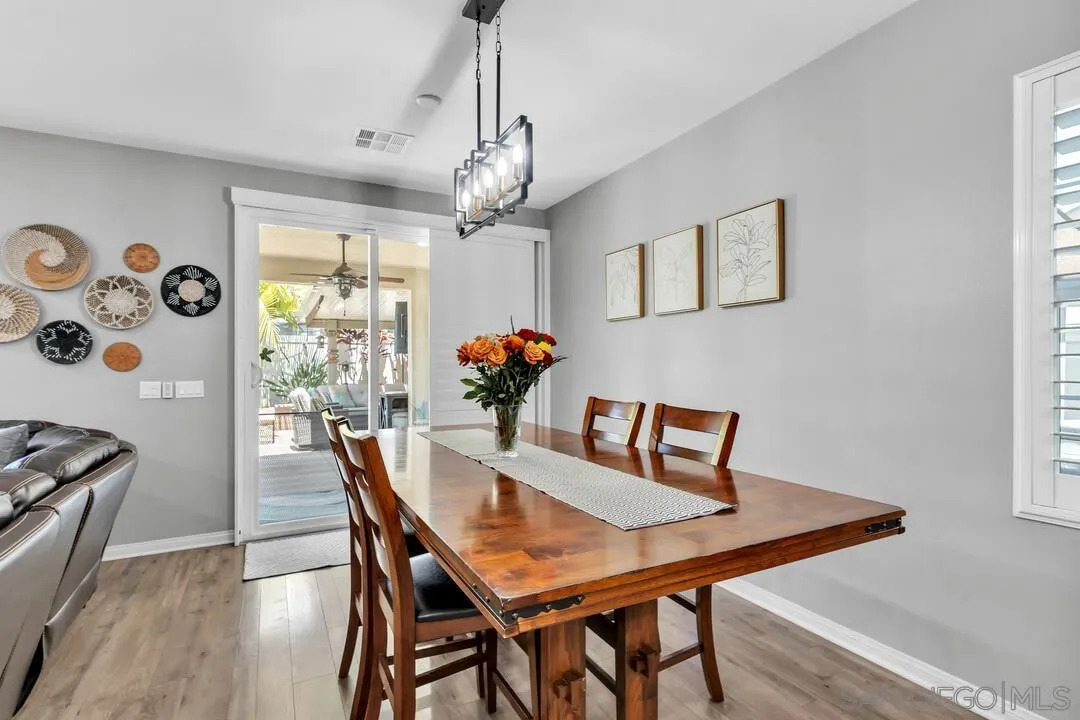 10700 Spring Creek Drive Santee, CA 92071 - Photo 20 of 74 a view of a dining room with furniture window and wooden floor