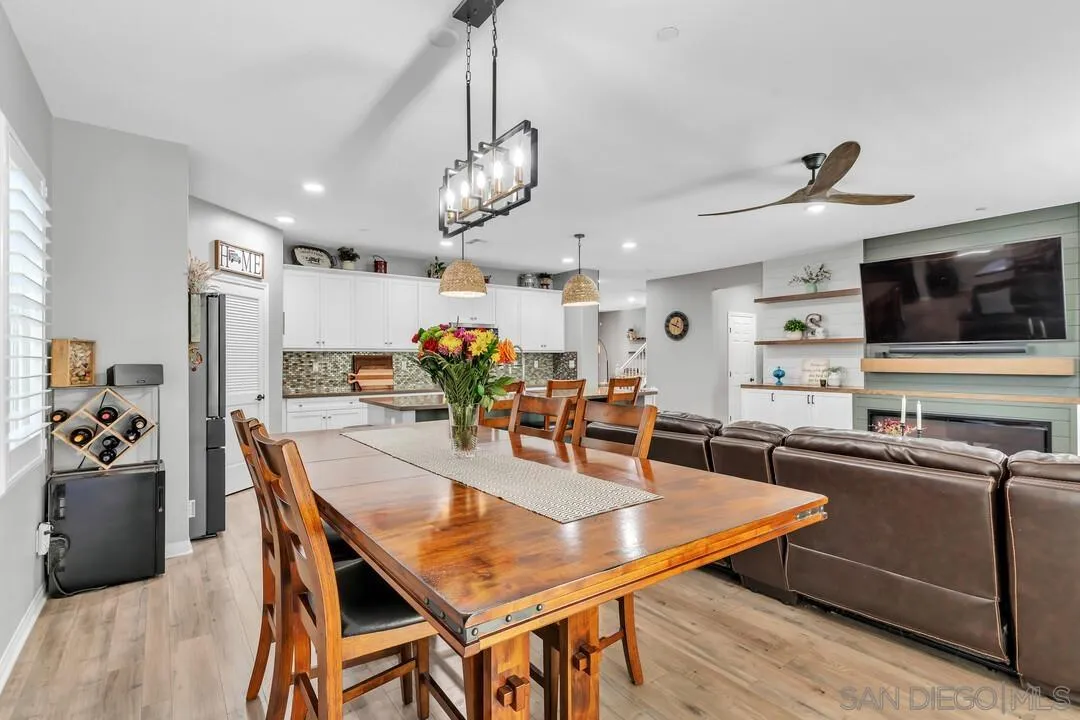 10700 Spring Creek Drive Santee, CA 92071 - Photo 21 of 74 a view of a dining room with furniture and wooden floor