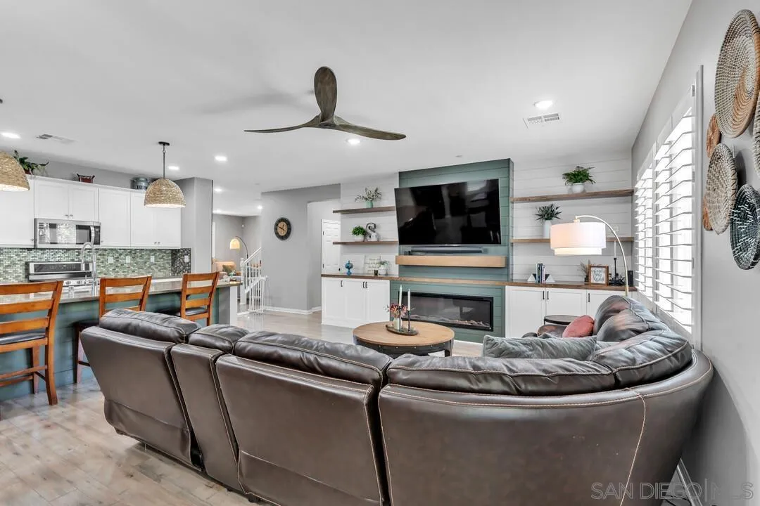 10700 Spring Creek Drive Santee, CA 92071 - Photo 24 of 74 a living room with fireplace furniture and a flat screen tv