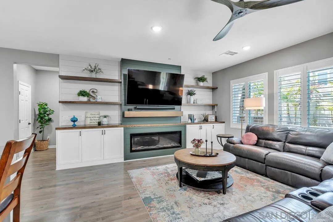 10700 Spring Creek Drive Santee, CA 92071 - Photo 25 of 74 a living room with furniture and a fireplace