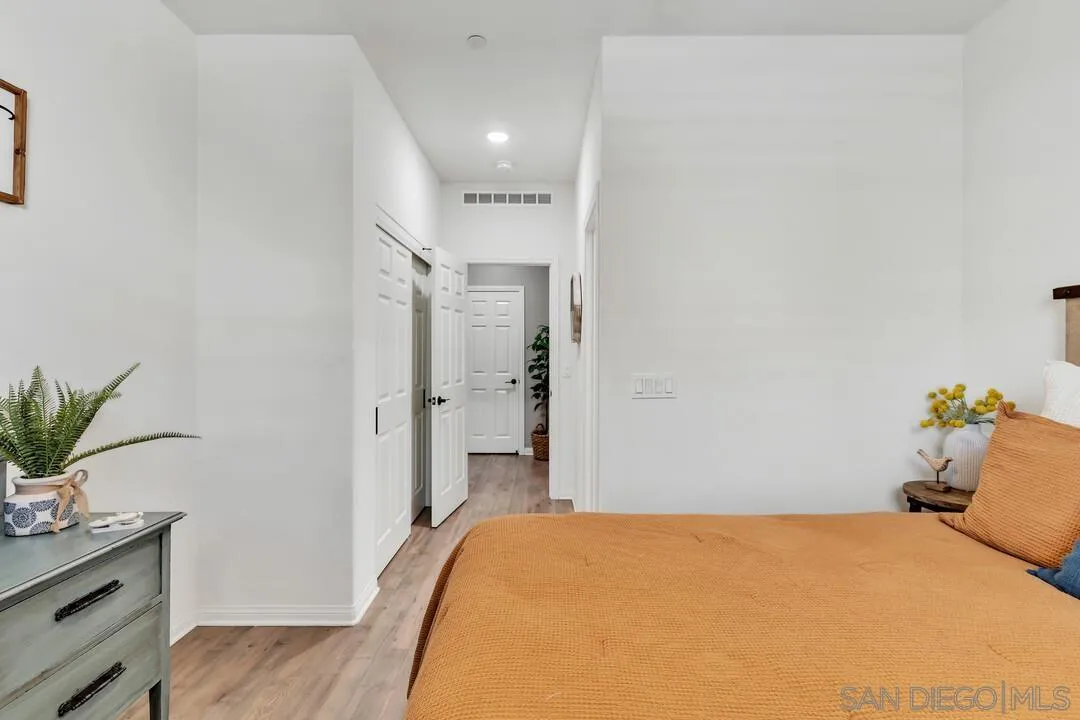 10700 Spring Creek Drive Santee, CA 92071 - Photo 30 of 74 a bedroom with a bed and hallway